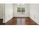 Formal dining room with hardwood floors, wainscoting, and bright natural light at 308 Evening Rain Crst, Canton, GA 30114