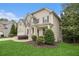 Charming home with manicured lawn and landscaping highlighting the side entrance at 308 Evening Rain Crst, Canton, GA 30114