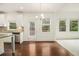 Open kitchen with stainless appliances, granite countertops and hardwood floors at 308 Evening Rain Crst, Canton, GA 30114