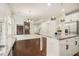 Gourmet kitchen featuring granite counters and stainless steel appliances, with a view into the living area at 308 Evening Rain Crst, Canton, GA 30114