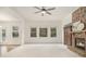 Bright and airy living room featuring a stone fireplace, neutral carpet, and lots of natural light at 308 Evening Rain Crst, Canton, GA 30114