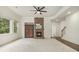 Spacious living room featuring a cozy fireplace, large windows, and neutral decor at 308 Evening Rain Crst, Canton, GA 30114