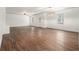 Large living room with hardwood floors and a ceiling fan, illuminated by natural light at 308 Evening Rain Crst, Canton, GA 30114