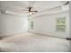 Spacious main bedroom with tray ceiling, ceiling fan, and bright windows at 308 Evening Rain Crst, Canton, GA 30114