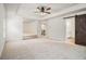 Large main bedroom featuring a tray ceiling, seating area, and barn door entrance at 308 Evening Rain Crst, Canton, GA 30114