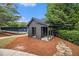 Neighborhood playhouse near tennis courts in a lush, wooded area with well-kept lawn at 308 Evening Rain Crst, Canton, GA 30114
