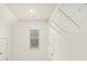 Well-lit room with white walls, window, storage shelves, and neutral-colored carpeting at 308 Evening Rain Crst, Canton, GA 30114