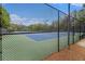 Fenced tennis courts on a sunny day, offering a great recreational amenity at 308 Evening Rain Crst, Canton, GA 30114