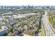 Aerial shot of a neighborhood near the freeway, showcasing lush greenery and city views at 516 Summit North Ne Dr, Atlanta, GA 30324