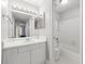 Bright bathroom featuring a vanity, well-lit mirror, shower, and stylish tile flooring, offering comfort and convenience at 516 Summit North Ne Dr, Atlanta, GA 30324