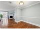 Spacious dining area with hardwood floors, and a fireplace, and open to the living room and sunroom, creating a welcoming atmosphere at 516 Summit North Ne Dr, Atlanta, GA 30324