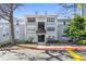 Charming two-story condo building with grey siding and well-maintained landscaping, offering a welcoming curb appeal at 516 Summit North Ne Dr, Atlanta, GA 30324