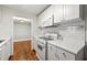 Bright kitchen features white cabinetry, subway tile backsplash, and stainless-steel appliances at 516 Summit North Ne Dr, Atlanta, GA 30324