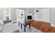 Inviting living room featuring hardwood floors, fireplace, and ample natural light with an open view to a sunroom at 516 Summit North Ne Dr, Atlanta, GA 30324