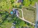 Aerial view of a home featuring a circular driveway and a backyard pool at 5360 Franklin Goldmine Rd, Cumming, GA 30028