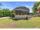 Backyard with pool area, screened in porch, and ample green space, great for outdoor activities at 5360 Franklin Goldmine Rd, Cumming, GA 30028