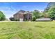 A spacious yard featuring a well-maintained lawn, an above-ground pool, and vibrant landscaping at 5360 Franklin Goldmine Rd, Cumming, GA 30028