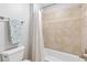 Bathroom featuring a white shower curtain, tiled walls, and a towel rack with a blue and white towel at 5360 Franklin Goldmine Rd, Cumming, GA 30028