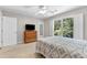 Spacious bedroom with carpet floors, natural light, and ensuite bathroom at 5360 Franklin Goldmine Rd, Cumming, GA 30028