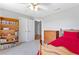 Charming bedroom features built-in bookcase, with carpet flooring at 5360 Franklin Goldmine Rd, Cumming, GA 30028