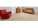 Bedroom with wooden furniture, including a bed and dresser, complemented by a comfortable recliner at 5360 Franklin Goldmine Rd, Cumming, GA 30028