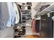 Organized walk-in closet with shelving and storage for clothing and shoes at 5360 Franklin Goldmine Rd, Cumming, GA 30028