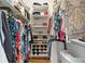 Organized walk-in closet with shelving and storage for clothing and shoes at 5360 Franklin Goldmine Rd, Cumming, GA 30028