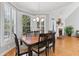 Formal dining room with hardwood floors, plantation shutters, and elegant chandelier at 5360 Franklin Goldmine Rd, Cumming, GA 30028