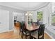 Bright dining room with hardwood floors, plantation shutters, and an open view to the office at 5360 Franklin Goldmine Rd, Cumming, GA 30028