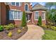 Inviting brick home entrance featuring a curved walkway and tasteful landscaping at 5360 Franklin Goldmine Rd, Cumming, GA 30028
