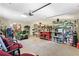 Spacious garage with workbench, shelving, and room for a lawn tractor at 5360 Franklin Goldmine Rd, Cumming, GA 30028