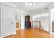 Open hallway with hardwood floors leading to other parts of the house at 5360 Franklin Goldmine Rd, Cumming, GA 30028