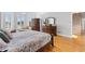 Spacious primary bedroom featuring hardwood floors and classic furniture at 5360 Franklin Goldmine Rd, Cumming, GA 30028
