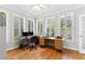 Sunny office with hardwood floors, plantation shutters, and a ceiling fan at 5360 Franklin Goldmine Rd, Cumming, GA 30028