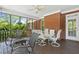 Spacious screened porch with ceiling fan, table and chairs, perfect for outdoor dining and entertaining at 5360 Franklin Goldmine Rd, Cumming, GA 30028