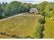 Expansive lawn with a charming brick home in the background at 5360 Franklin Goldmine Rd, Cumming, GA 30028
