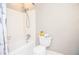 Bathroom featuring white tile, a tub-shower combo, and neutral wall color at 970 Winding Creek Trl, Sandy Springs, GA 30328