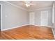 Bedroom features hardwood floors, fresh paint, and a dual door closet at 970 Winding Creek Trl, Sandy Springs, GA 30328