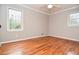 Spacious bedroom with hardwood floors, neutral walls, ceiling fan and two windows at 970 Winding Creek Trl, Sandy Springs, GA 30328