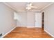 Bedroom features a ceiling fan, hardwood floors and fresh paint at 970 Winding Creek Trl, Sandy Springs, GA 30328