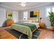 Staged bedroom featuring hardwood floors, ceiling fan, and natural light at 970 Winding Creek Trl, Sandy Springs, GA 30328
