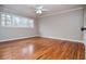 Bedroom features hardwood floors, fresh paint, and natural light at 970 Winding Creek Trl, Sandy Springs, GA 30328