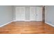 Bedroom with hardwood floors, fresh paint, multiple closets and view to ensuite at 970 Winding Creek Trl, Sandy Springs, GA 30328