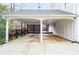 Spacious carport featuring wooden accents and ample covered parking space with a deck at 970 Winding Creek Trl, Sandy Springs, GA 30328