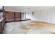 Large carport with concrete floor, wood supports and access to the outdoor deck at 970 Winding Creek Trl, Sandy Springs, GA 30328