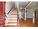 Foyer with wooden floors leading to a staircase and living areas at 970 Winding Creek Trl, Sandy Springs, GA 30328