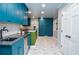 Bright kitchen features custom cabinets, geometric tile floor, and sleek countertops at 970 Winding Creek Trl, Sandy Springs, GA 30328
