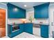 Bright kitchen featuring custom cabinets, stainless steel appliances, and geometric tiled floor at 970 Winding Creek Trl, Sandy Springs, GA 30328