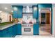 Beautiful kitchen with stainless appliances, custom cabinets, geometric floors, and sleek countertops at 970 Winding Creek Trl, Sandy Springs, GA 30328