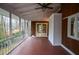 Cozy screened porch with wood paneling, ceiling fan and outdoor views through multiple screened windows at 970 Winding Creek Trl, Sandy Springs, GA 30328